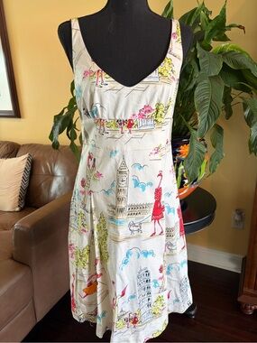 Becky & Max sleeveless dress in a novelty retro“travel” fun print - size 4